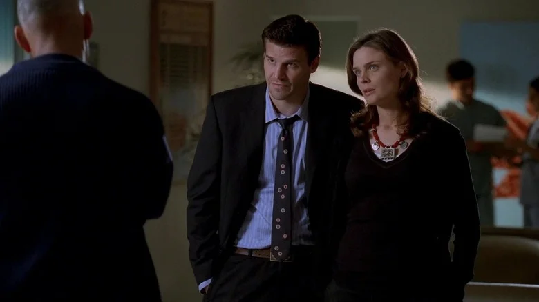 Bones and Booth talking to a man in a suit on Bones