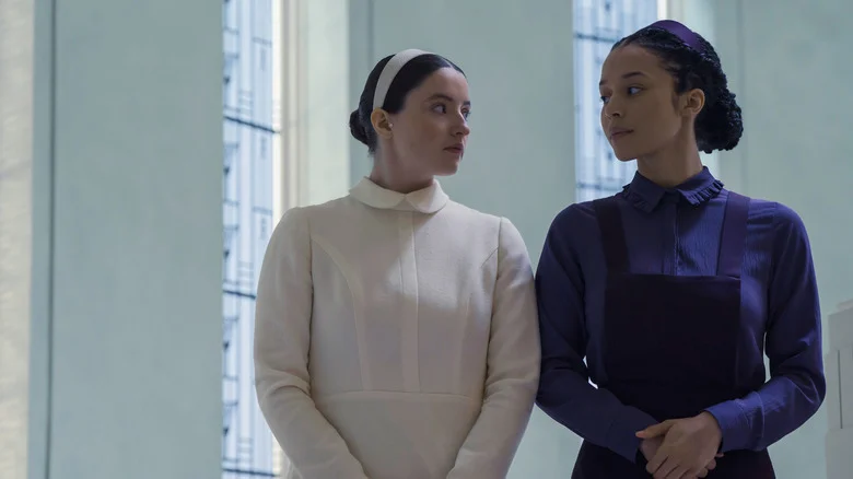 Daisy and Agnes looking at each other in The Testaments