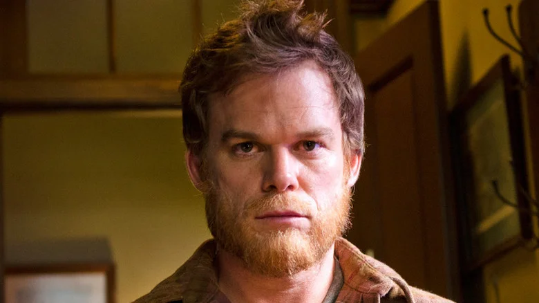 A scruffy Dexter Morgan (Michael C. Hall) stares blankly ahead in Dexter